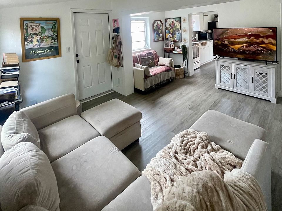 Large Living room area. ample furniture space capable to house a full sectional along side a love seat and home entertainment center.