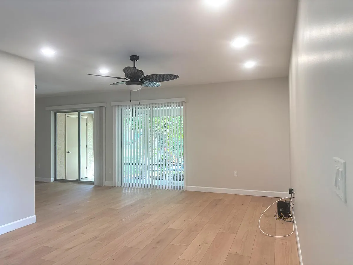 Bright, open living area with brand-new finishes throughout _ completely renovated from walls to ceiling. - 6338 7th Ave W #6338