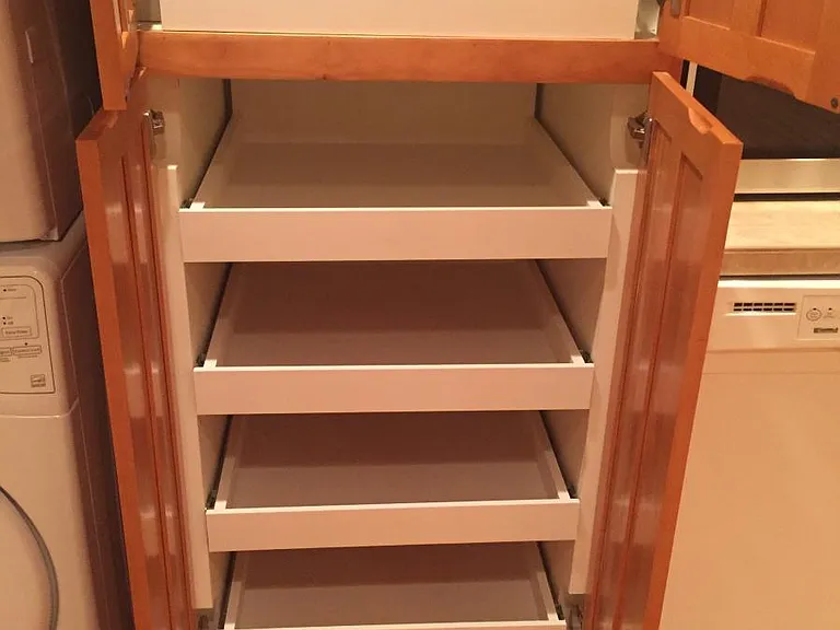 Built-in pull out shelving in kitchen cabinetry