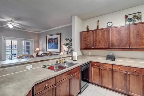Kitchen with Black Appliances & Ample Cabinetry - Bermuda Estates at Ormond Beach