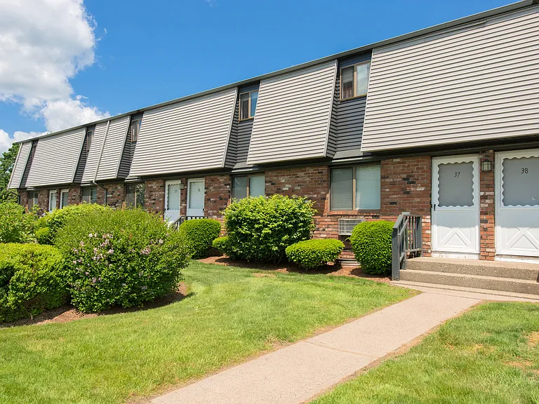 Experience the allure of classic red brick charm and lush green surroundings in our well-cared-for community.