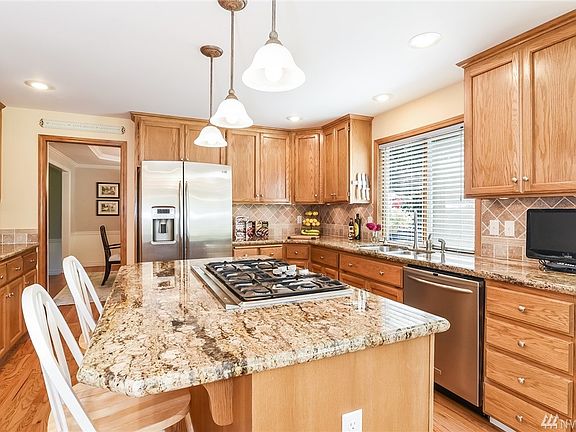 Welcome to your bath oasis! Tile floors, quarts double vanity, free standing soaking tub, walk-in shower and a chandelier.