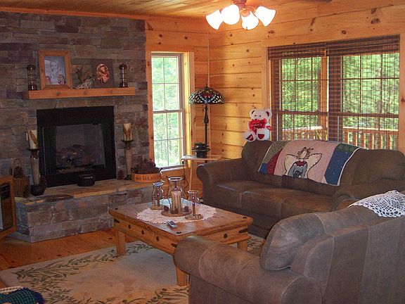 Living room with stone wood burning FP