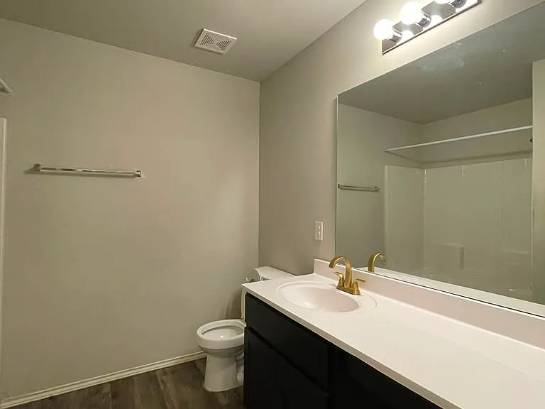 Common bathroom to the right from the entrance. Also Includes a spacious closet and bathtub.