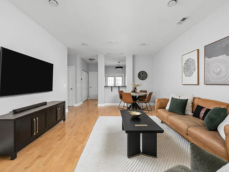 Living Room that leads into kitchen with walk out porch