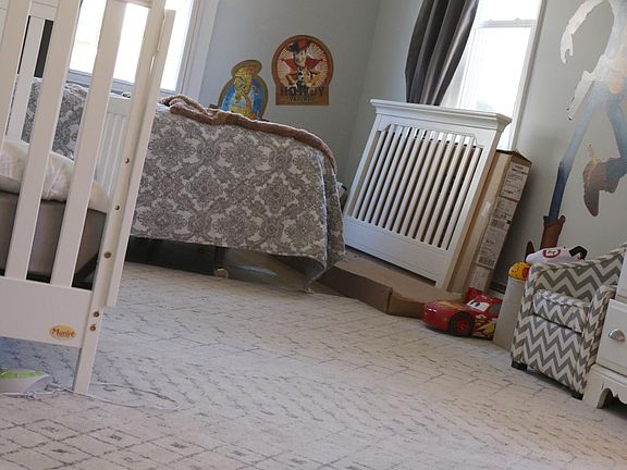 Spacious bedroom with hardwood floor
