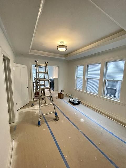 Formal dining room with a full wall of windows and so flooded with light.