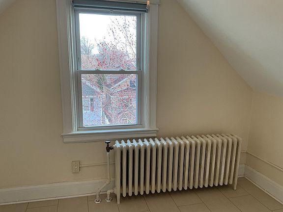 Third photo of bedroom with large radiator