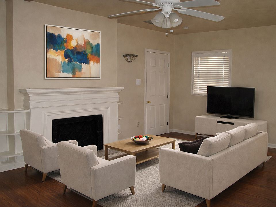 Nice size living room with a mock fireplace for extra charm!