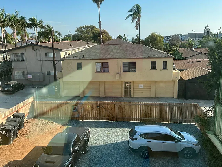Fully fenced in parking in the back