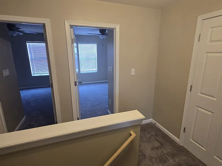 Top of stairs showing bedroom 3 (right) and bedroom 4 (left)