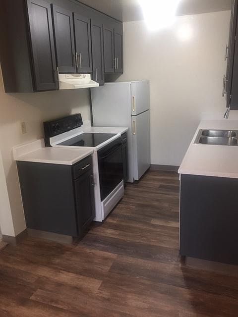 Remodeled Kitchen with New Floors, Countertops and Cabinets
