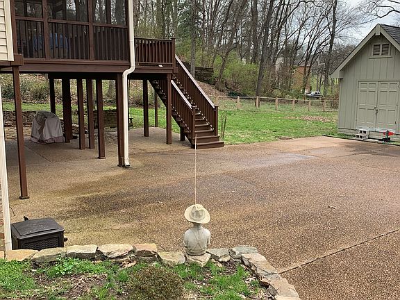 Right side by driveway.