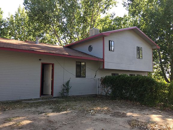 North side of house with walk door from garage