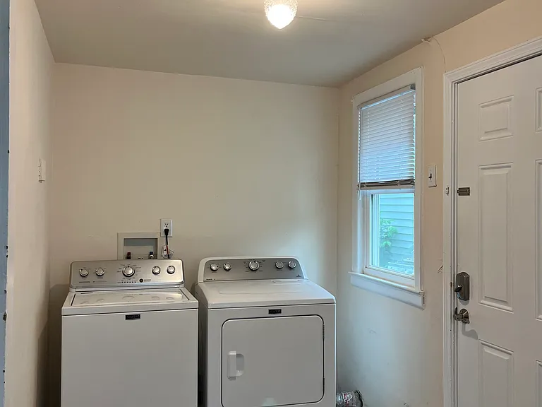 Your own private and spacious laundry room with good natural light.