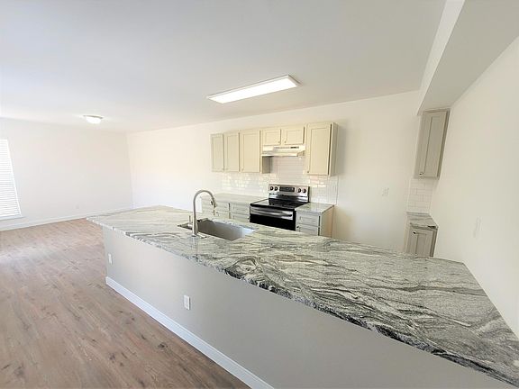 Sherwin Williams Mindful Gray painted cabinets