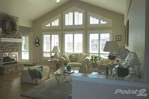 Bright  Living Room with a Plethora of Windows looking at Pikes Peak