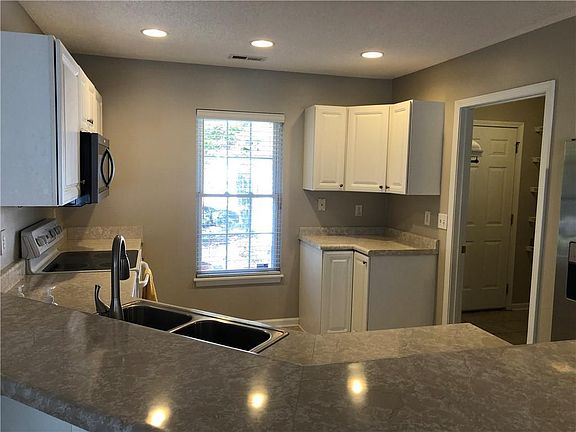 Large Open Kitchen Overlooking the Living Room Area