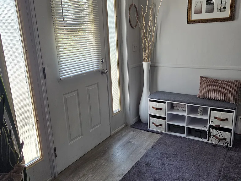 Front Door entrance into Living Room