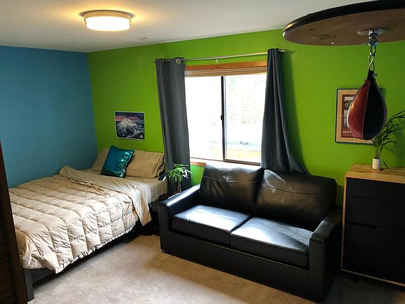 Bedroom #1 downstairs (don't worry, walls are white now :) ). 2 large closets. Largest downstairs bedroom. Shown with Queen bed, queen pull out and full sized dresser.