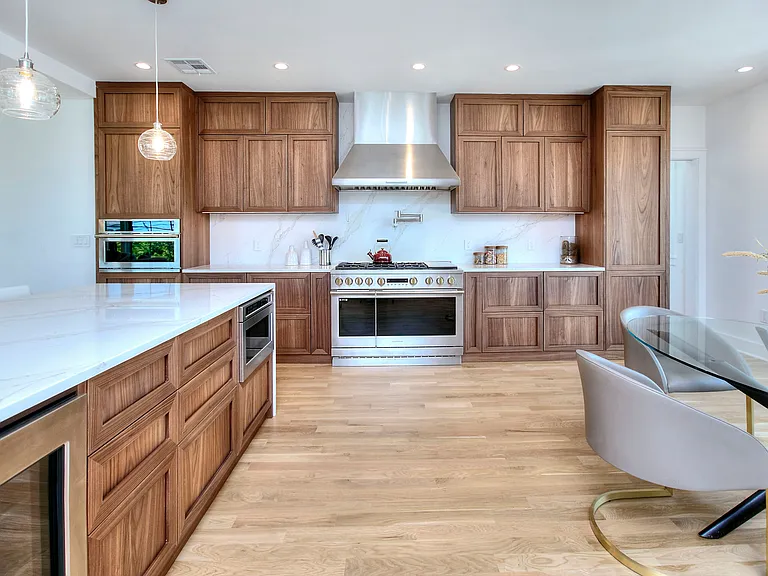 Gourmet stainless appliances. Island with drawer microwave and beverage cooler.