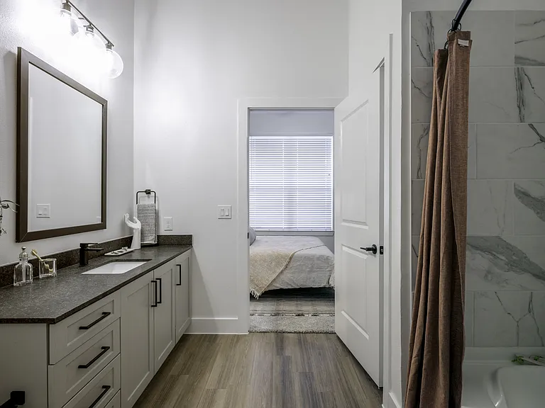 Escape to tranquility in Modera Walsh's serene bathrooms, where spa-like soaking tubs offer the ultimate relaxation experience.
