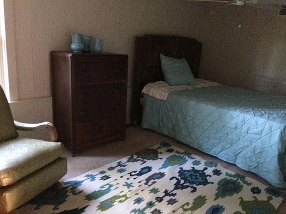 One Bedroom furnished with carpet