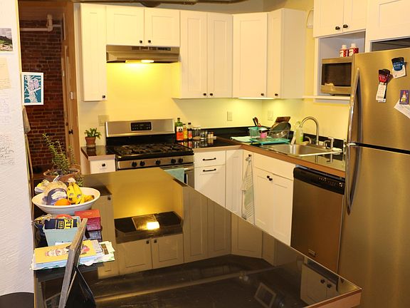 Kitchen with SS appliances, gas stove, Tempered glass counter tops.