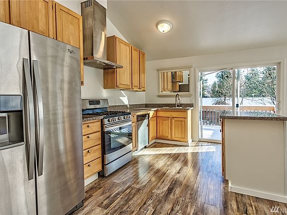 Beautiful granite surfaces and stainless appliances.
