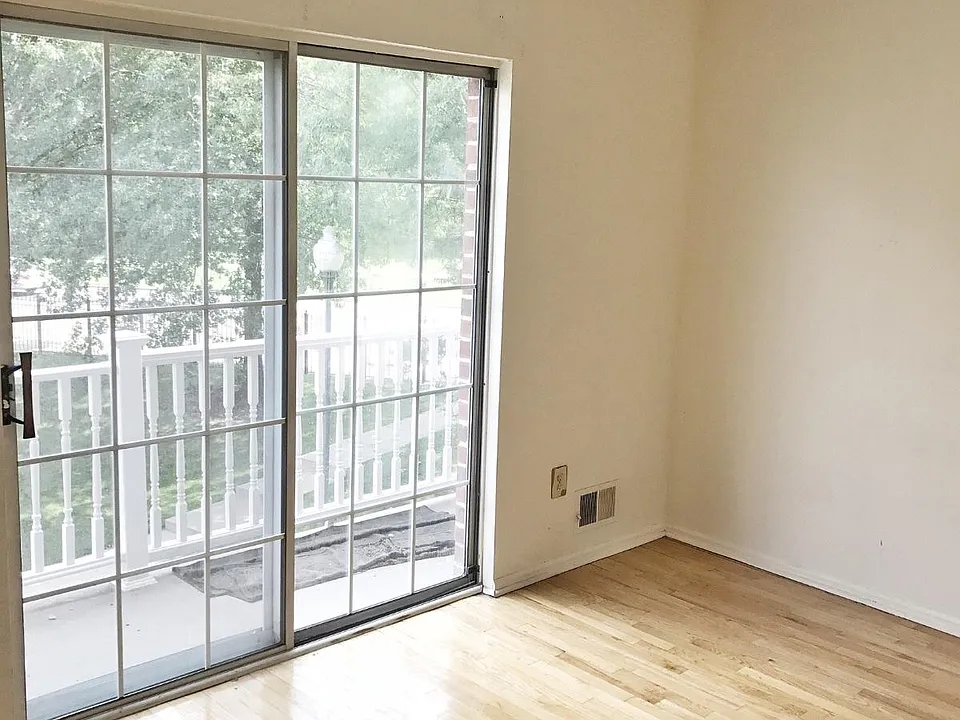 1st bedroom on level 1 with balcony
