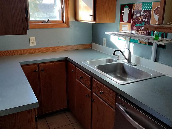 Plenty of cabinets with stainless steel dish washer