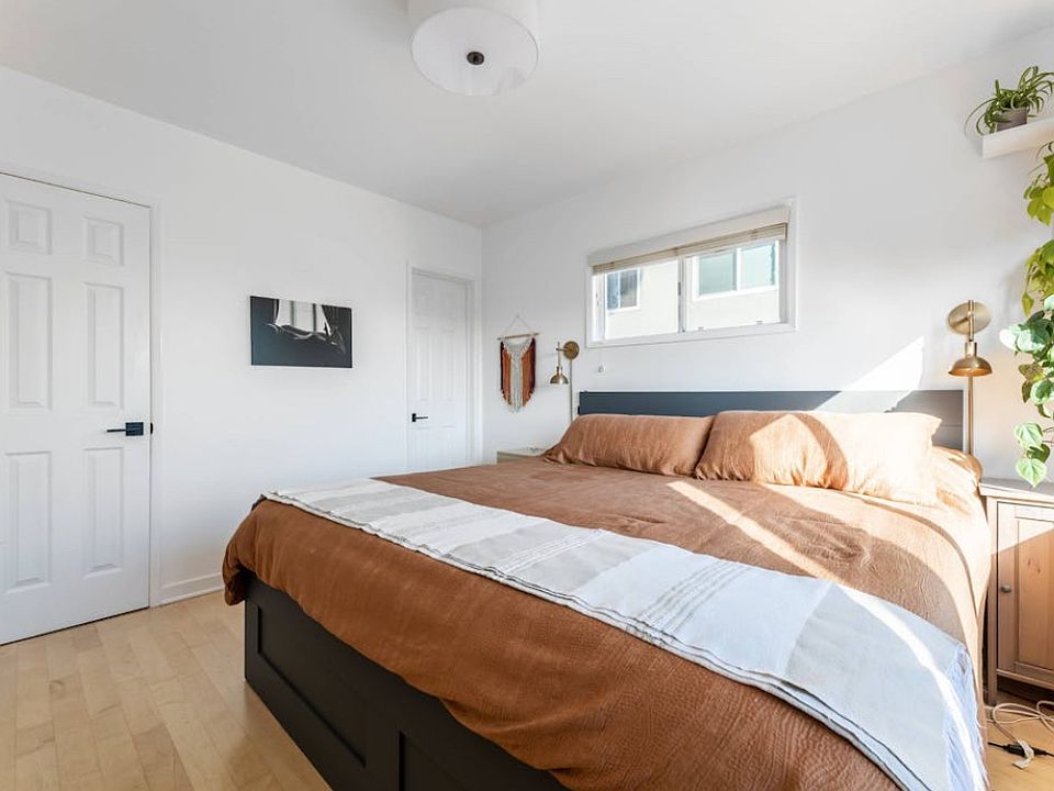 King bed with storage drawers beneath.