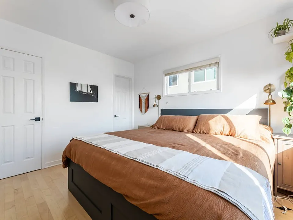 King bed with storage drawers beneath.