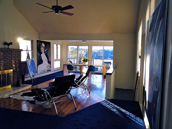 Spacious Living Room with Cathedral Ceilings and 180 degree view of Lake