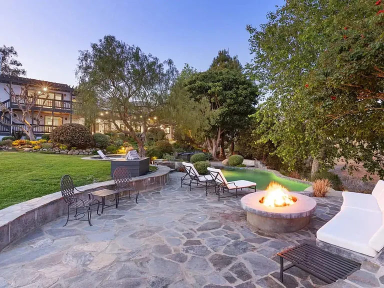 Peaceful garden and maintained backyard wrapped in a blanket of lush, green lawns.