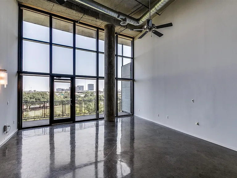 Expansive floor-to-ceiling windows with balcony access