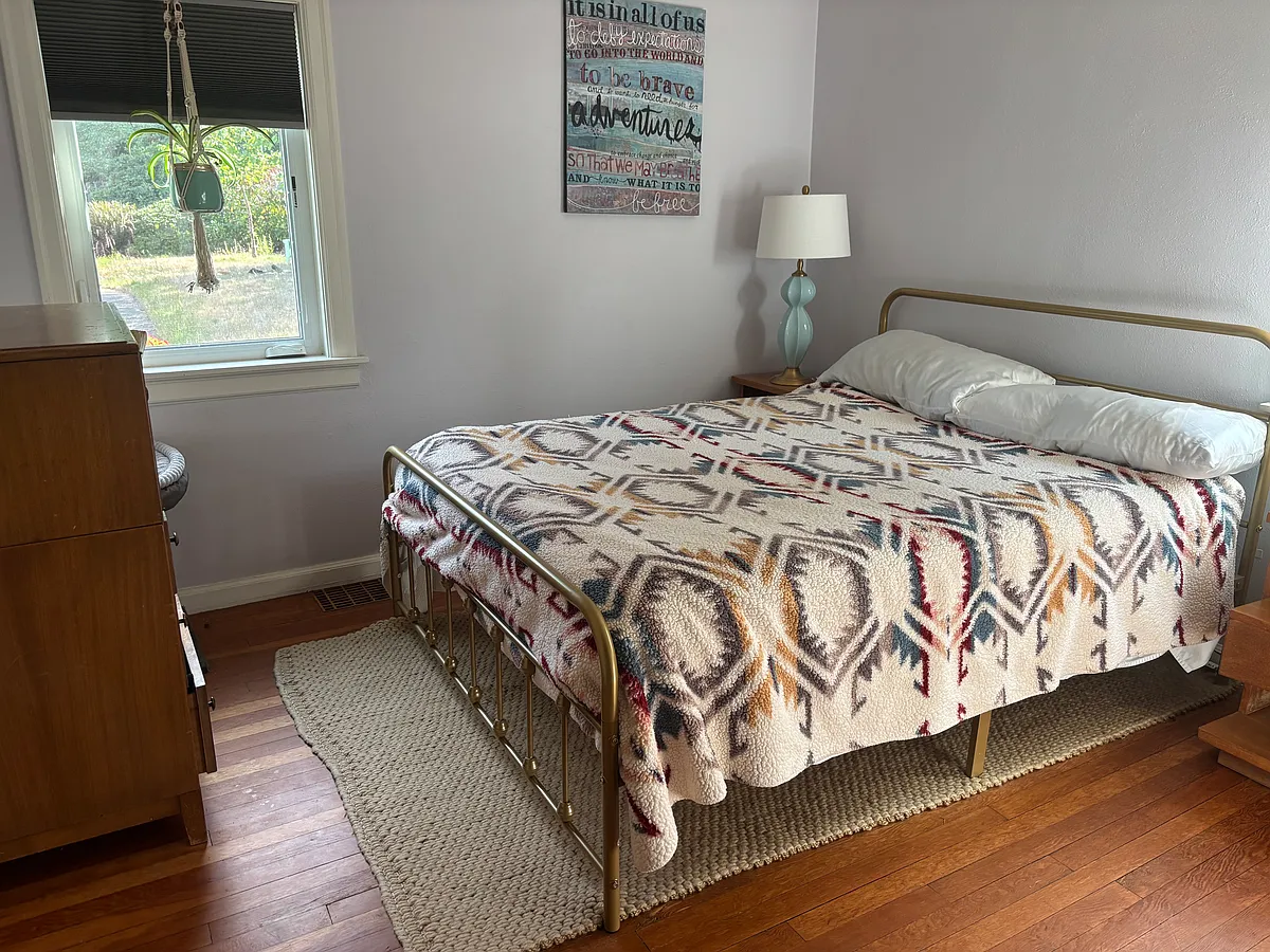 One of the bedrooms. Both downstairs bedrooms are 11'X11' and are the same flooring and paint. - 5616 N 49th St