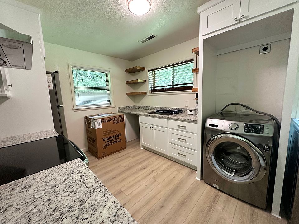 Older photo: Dryer will stack on top of washer. Dishwasher and plumbing fixtures have been installed already.