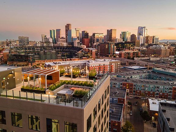 Enjoy stunning rooftop views with a vibrant cityscape backdrop.