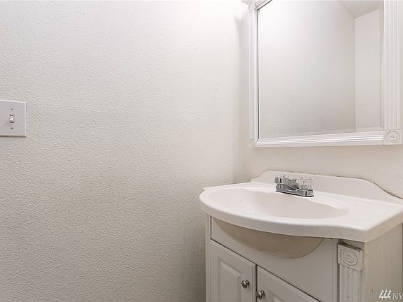 Bathroom straight ahead from front door. 