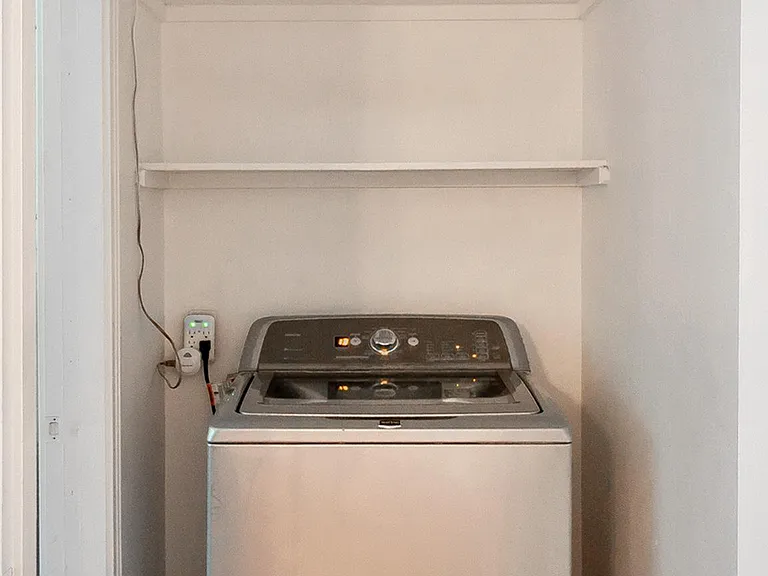 washer. dryer outside in storage area