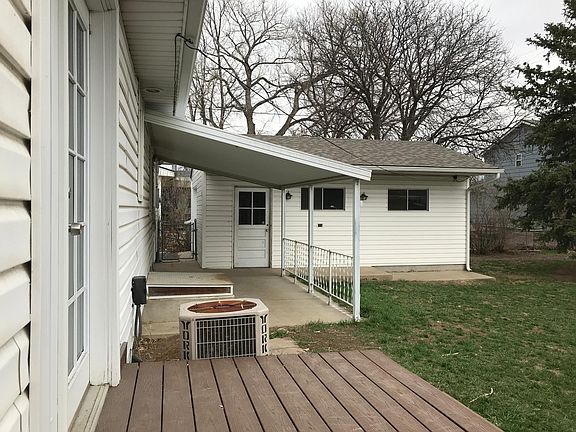 Backyard w/ covered patio.