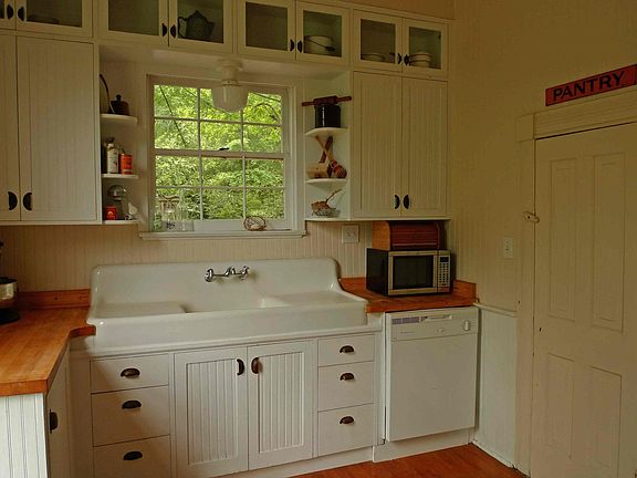 Double-drainboard farmhouse sink, large pantry off kitchen