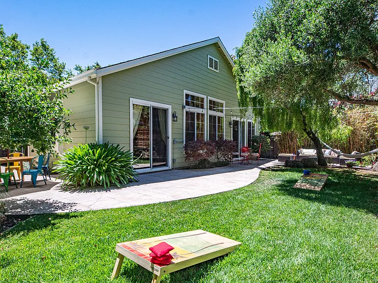 Backyard fun! Play cornhole, chill in the hammock or have a cup of coffee in your private backyard.