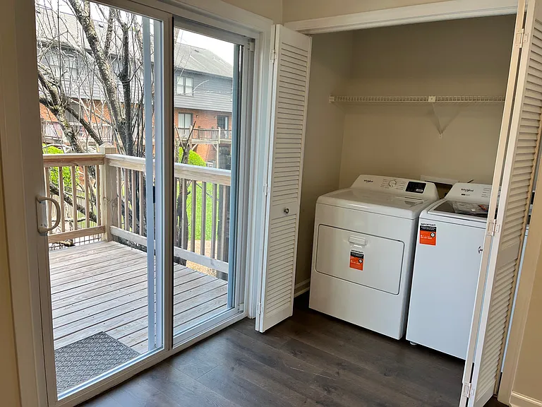 New washer and dryer -- next to patio door