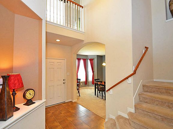 Bright and airy entry way with art niche