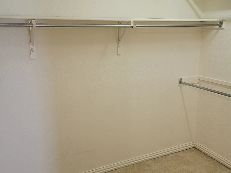 large walk in closet within primary bedroom