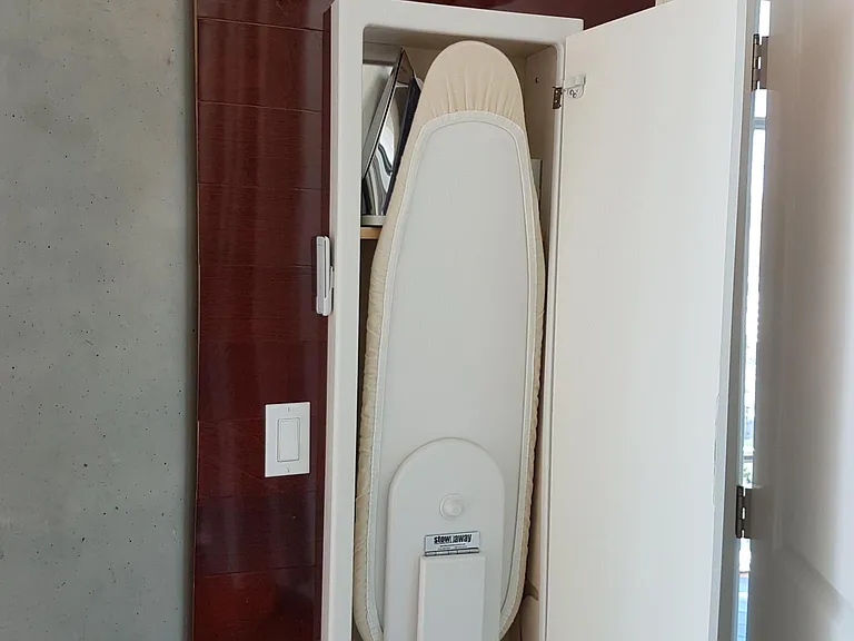 Built-in ironing board with iron