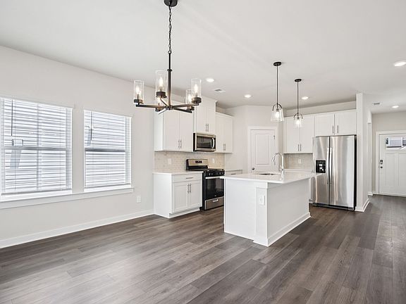 The open-concept floorplan allows for an easy flow between the kitchen and dining areas.