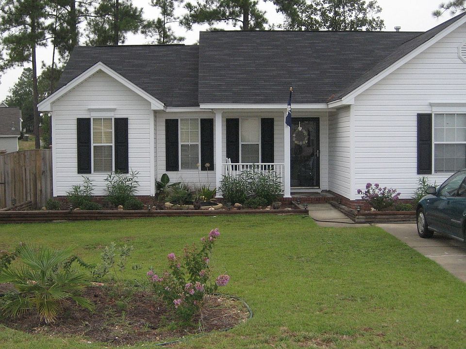 Beautfiul Landscaping with dual container gardens illuminated by solar lights